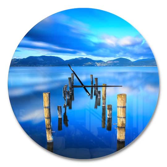 Designart 'Wooden Pier Remains In Blue Sea Modern Wall Clock